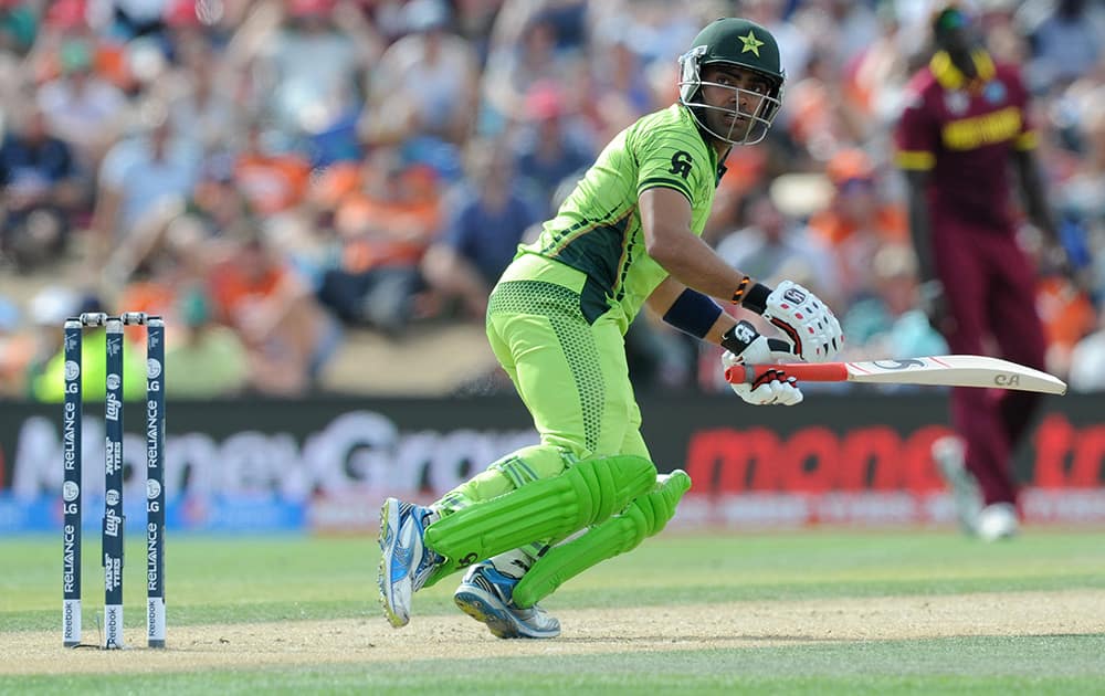 Pakistan's batsman Umar Akmal watches his shot during their Cricket World Cup match against the West Indies in Christchurch, New Zealand.