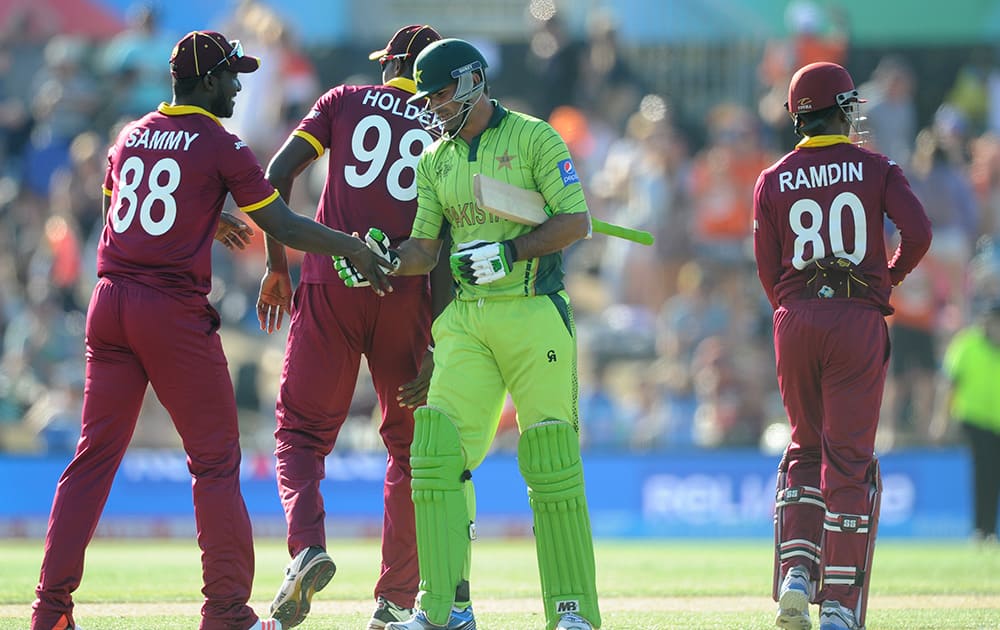 Pakistan's Sohail Khan congratulates West Indies Darren Sammy, after they lost their Cricket World Cup match by 150 runs in Christchurch, New Zealand.