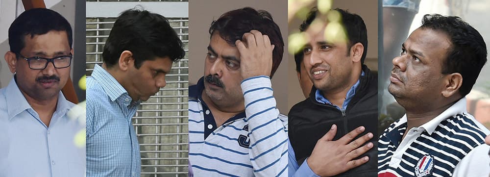 Five senior executives from top energy firms , arrested in connection with corporate espionage scandal, before they were produced in a court in New Delhi.
