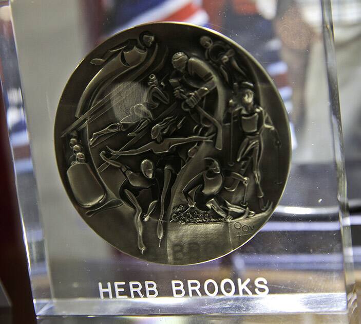 A 1980 Olympic Games participation medal presented to hockey great Herb Brooks is displayed before an auction in New York.