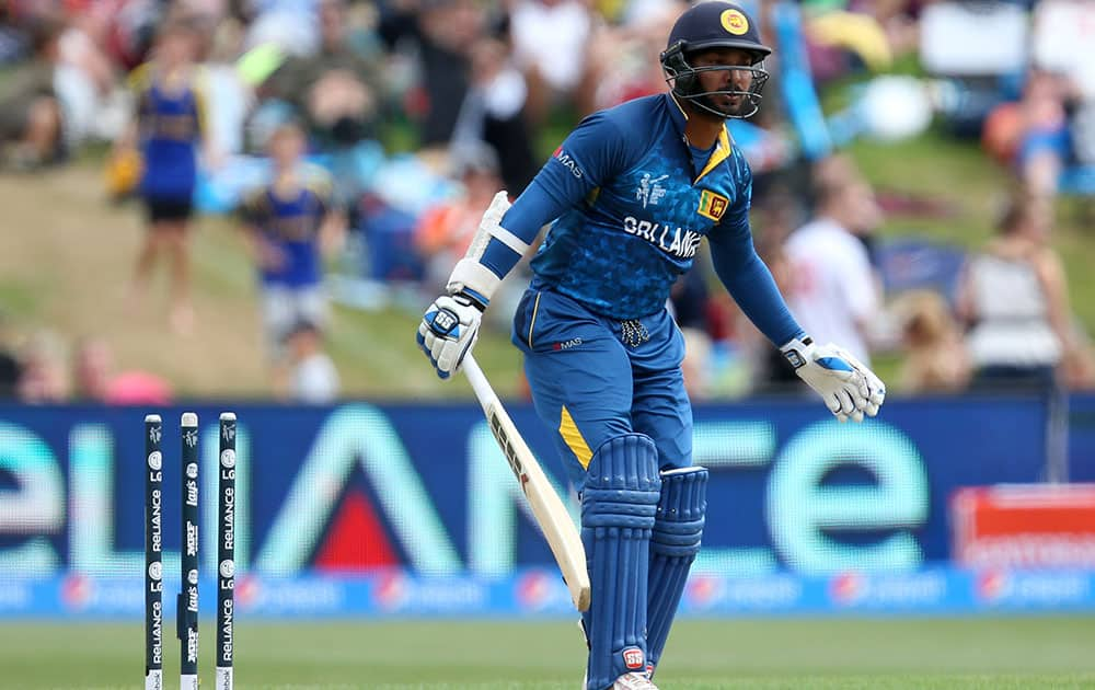 Sri Lankan batsman Kumar Sangakkara reacts after he was bowled by Afghanistan’s Hamid Hassan for seven runs during their Cricket World Cup match in Dunedin, New Zealand.