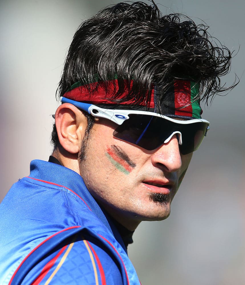 Afghanistan’s Hamid Hassan watches play during their Cricket World Cup match against Sri Lanka in Dunedin, New Zealand.