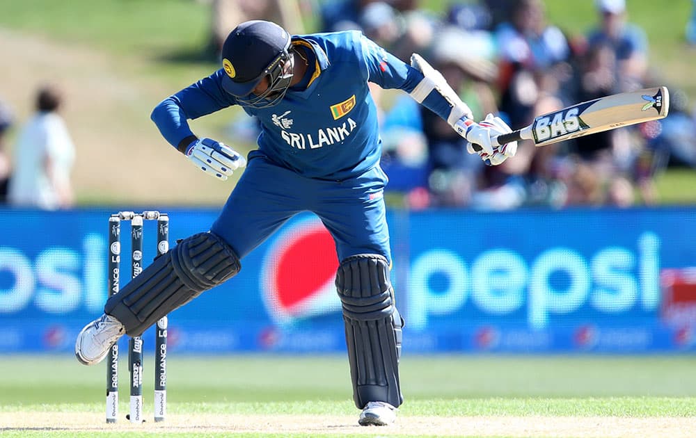 Sri Lanka's Mahela Jayawardena reacts after he was hit by the ball during their Cricket World Cup match against Afghanistan in Dunedin, New Zealand.