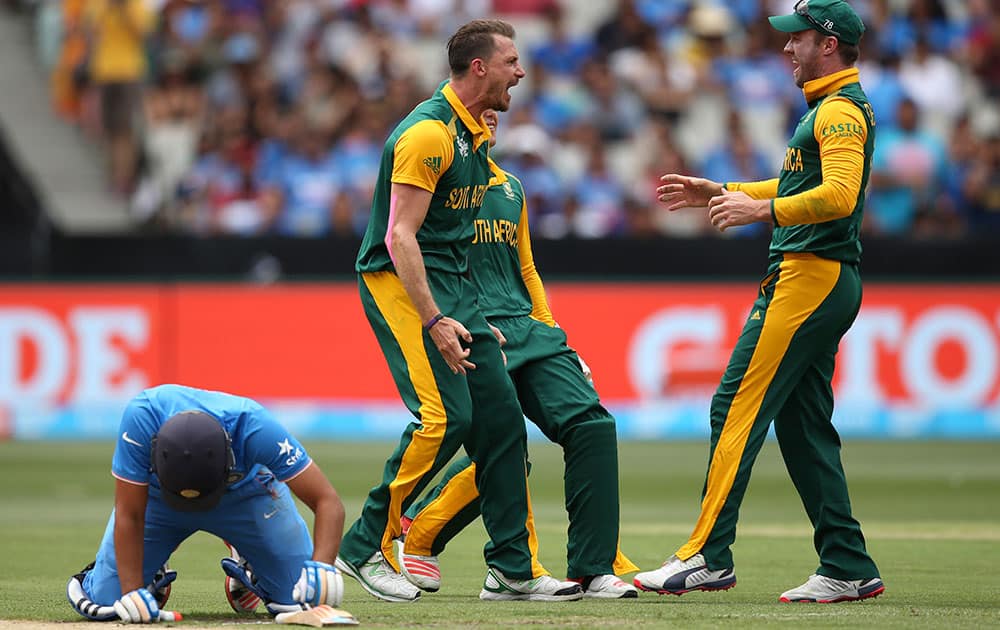 South African players celebrate the wicket of India's Rohit Sharma during their Cricket World Cup pool B match in Melbourne, Australia.