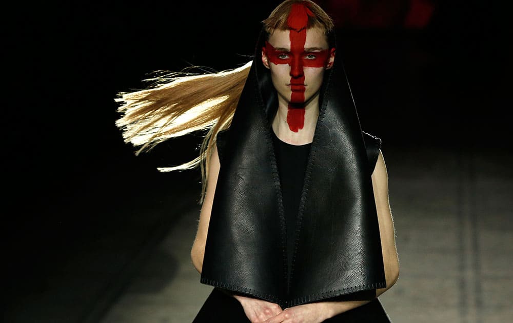 A model wears an outfit by designer Gareth Pugh during his Autumn/Winter 2015 show at London Fashion Week.