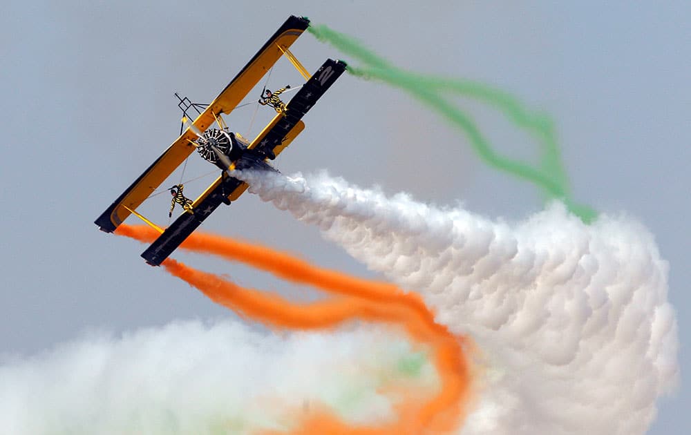 Skycat Wingwalkers from the Scandinavian Airshow aerobatic team perform on the forth day of Aero India 2015 at Yelahanka air base in Bangalore, India.