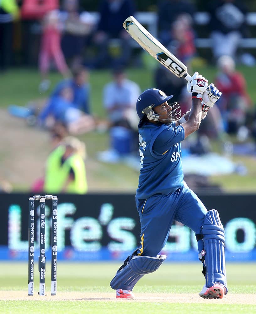 Sri Lanka's Mahela Jayawardena watches as he hits the ball to the boundary during their Cricket World Cup match against Afghanistan in Dunedin, New Zealand.