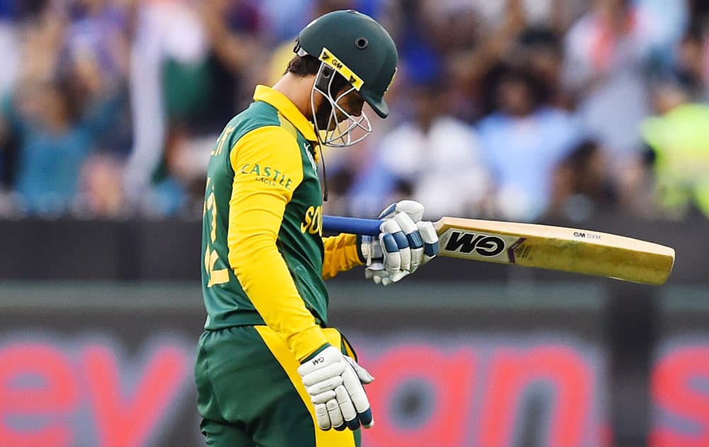 South Africa's Quinton De Kock walks from the field after he was dismissed seven runs during their Cricket World Cup pool B match in Melbourne, Australia.