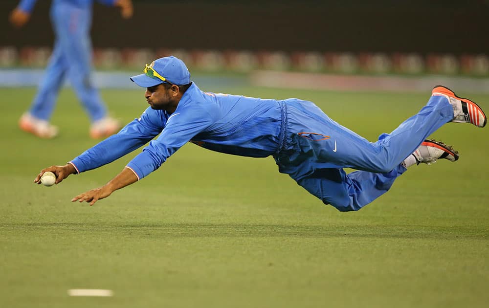 India's Suresh Raina fields during their Cricket World Cup pool B match against South Africa in Melbourne, Australia.