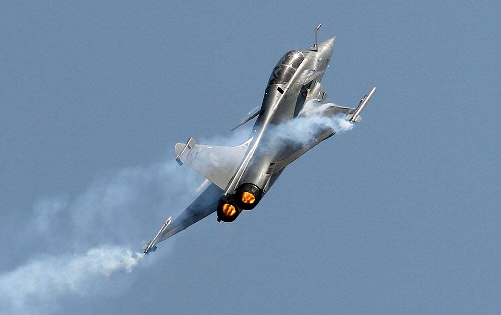 Rafale, a French fighter aircraft flies over static display area on the final day of Aero India air show at Yelahanka air base in Bangalore, India.