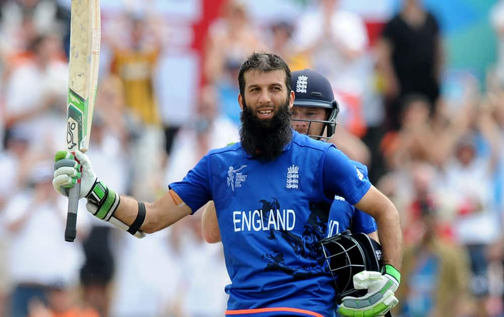 England's Moeen Ali waves to the crowd after reaching a century during their Cricket World Cup match against Scotland in Christchurch, New Zealand.