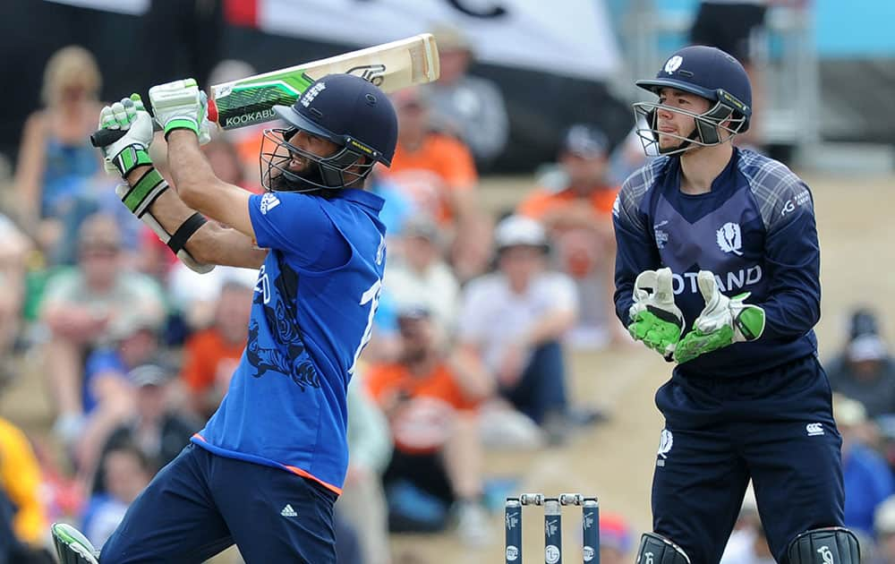 England's Moeen Ali play's a pull shot as Scotland's wicketkeeper Matt Cross follow's the ball during their Cricket World Cup match in Christchurch, New Zealand.