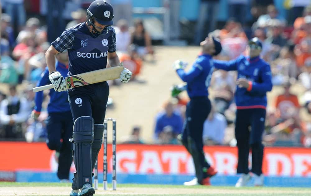 Scotland's Calum MacLeod walks from the field after he was dismissed for four runs during their Cricket World Cup match against England in Christchurch, New Zealand.