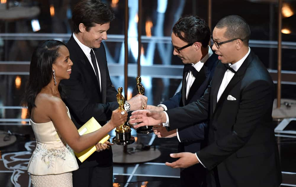 Kerry Washington, from left, and Jason Batemen present Mat Kirkby and James Lucas with the award for best live action short film for “The Phone Call” at the Oscars, at the Dolby Theatre in Los Angeles.