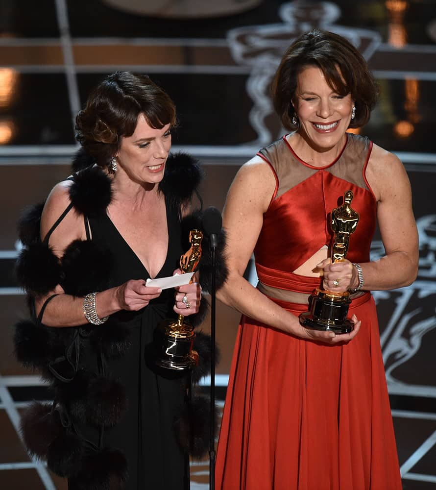 Dana Perry, left, and Ellen Goosenberg Kent accept the award for best short subject documentary for “Crisis Hotline: Veterans Press 1” at the Oscars, at the Dolby Theatre in Los Angeles. 