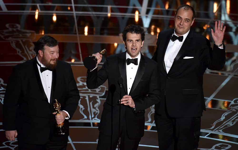 Thomas Curley, from left, Craig Mann and Ben Wilkins accept the award for best sound mixing for “Whiplash” at the Oscars, at the Dolby Theatre in Los Angeles. 