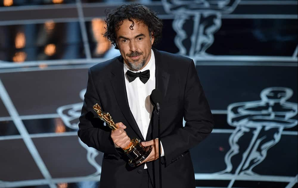 Alejandro G. Inarritu accepts the award for best director for “Birdman or (The Unexpected Virtue of Ignorance)” at the Oscars.