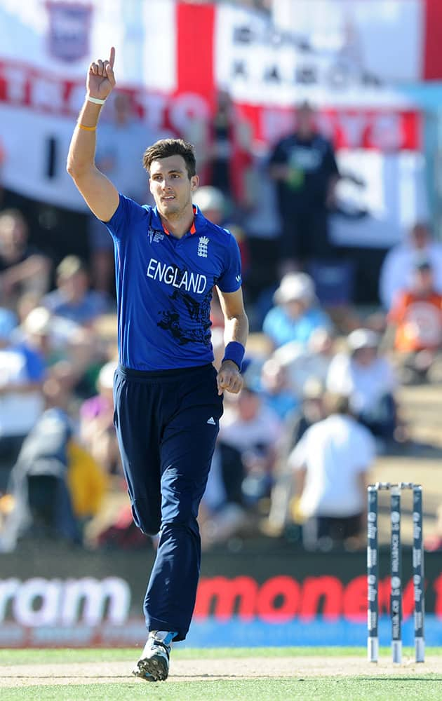 England's Steven Finn celebrate safer taking the wicket of Scotland's Josh Davey during their Cricket World Cup match in Christchurch, New Zealand.