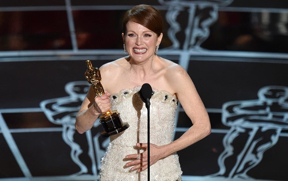 Julianne Moore accepts the award for best actress in a leading role for “Still Alice at the Oscars.