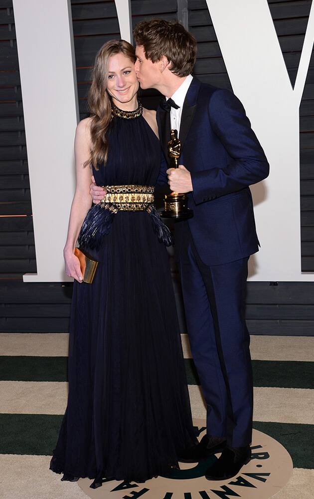 Hannah Bagshawe, left, and Eddie Redmayne arrive at the 2015 Vanity Fair Oscar Party on Sunday, in Beverly Hills, Calif.