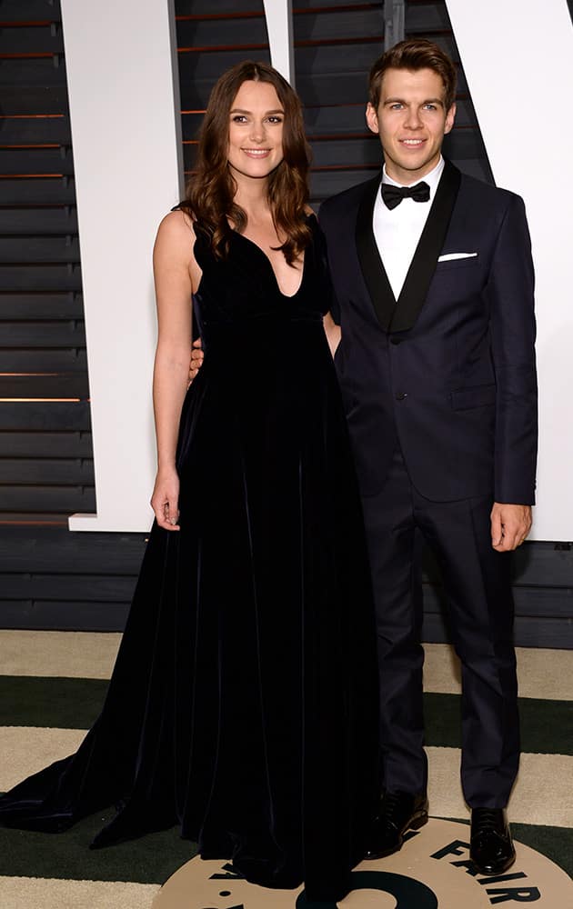 Keira Knightley, left, and James Righton arrive at the 2015 Vanity Fair Oscar Party.