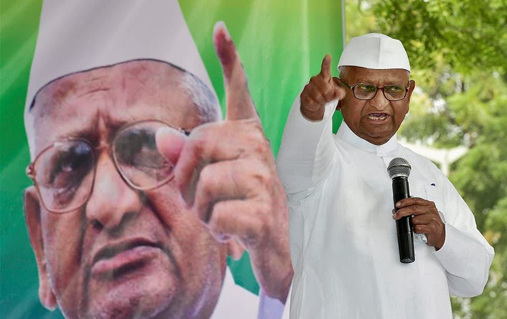 Social activist Anna Hazare addresses his supporters on the first day of his two-day agitation against the ordinance on Land Acquisition Bill at Jantar Mantar in New Delhi.