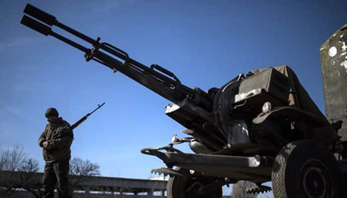 Ukrainians to withdraw heavy weapons after full ceasefire