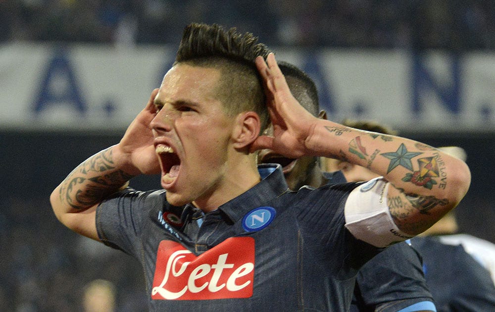 Napoli's Mareck Hamsik celebrates after scoring second goal during a Serie A soccer match between Napoli and Sassuolo, at the San Paolo stadium in Naples, Italy.