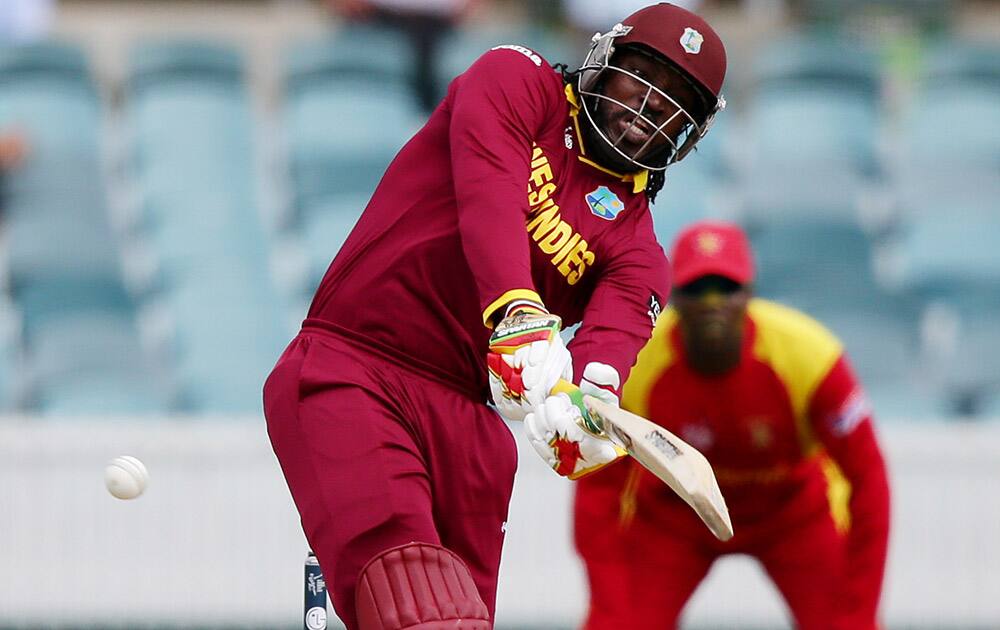 West Indies batsman Chris Gayle hits the ball during their Cricket World Cup Pool B match against Zimbabwe in Canberra, Australia.