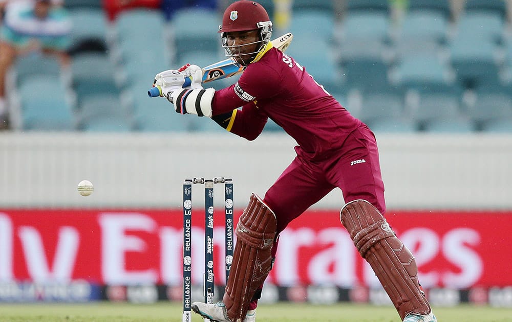 West Indies Marlon Samuels looks to hit the ball during their Cricket World Cup Pool B match against Zimbabwe in Canberra, Australia.