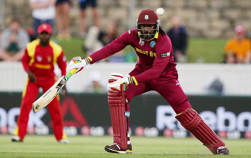 West Indies batsman Chris Gayle hits the ball during their Cricket World Cup Pool B match against Zimbabwe in Canberra, Australia.