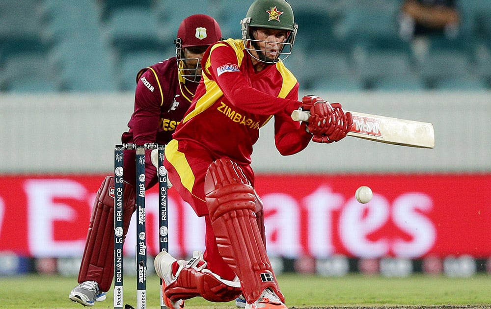 Zimbabwe's Sean Williams looks to play a sweep shot during their Cricket World Cup Pool B match against the West Indies in Canberra, Australia.