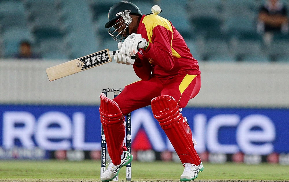 Zimbabwe's Tendai Chatara ducks under a ball during their Cricket World Cup Pool B match against the West Indies in Canberra, Australia.