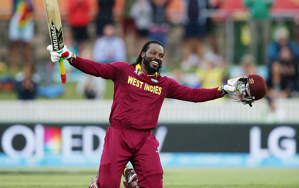 West Indies batsman Chris Gayle celebrates after scoring a double century during their Cricket World Cup Pool B match against Zimbabwe in Canberra, Australia.