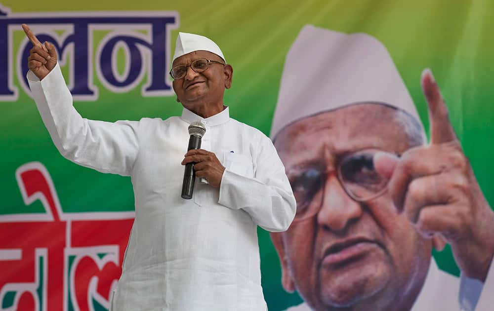 India's anti-corruption activist Anna Hazare speaks as he leads a protest by farmers against the government’s proposed move to ease rules for acquiring land to facilitate infrastructure projects in New Delhi.