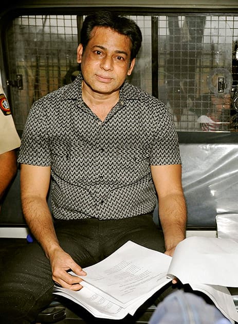 Gangster Abu Salem is taken to jail after a Mumbai court on Wednesday sentenced him life imprisonment in Pradeep Jain murder case.