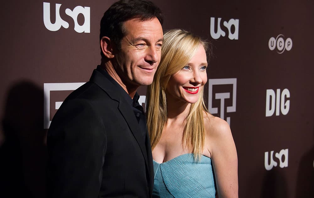 Jason Isaacs and Anne Heche attend the premiere of the USA Network's new series 