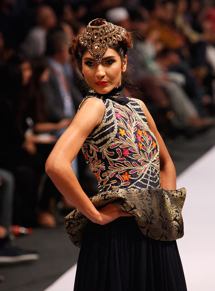 A model presents creations by Pakistani designer Akif Mahmood at Expo Pakistan Fashion Show 2015.