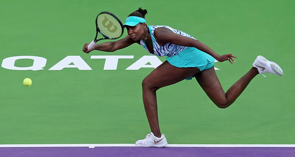 Venus Willams of the US returns the ball to Agnieszka Radwanska of Poland during the quarterfinals of the WTA Qatar Ladies Open in Doha, Qatar.