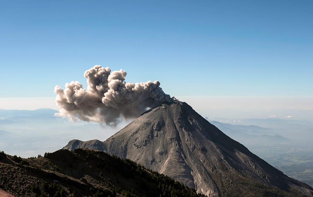 A large cloud of ash and steam rises from the crater of the Colima Volcano as seen from the civil protection observatory near Ciudad Guzman, Mexico.