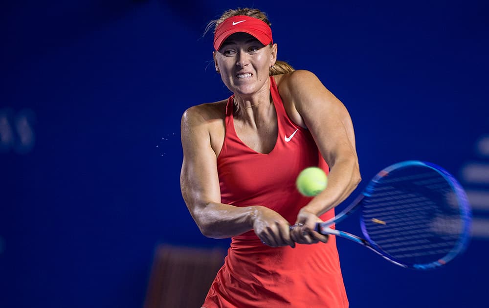 Maria Sharapova of Russia returns the ball to Magdalena Rybarikova of Slovakia during a Mexican Tennis Open quarterfinal match in Acapulco, Mexico.