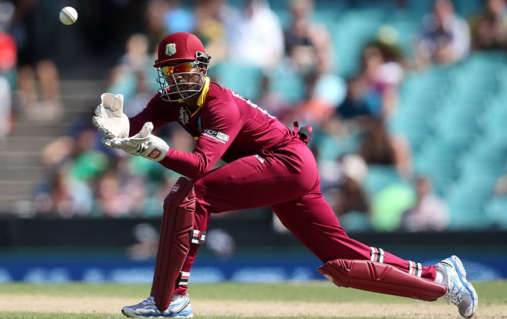 West Indies wicketkeeper Denesh Ramdin catches the ball during their Cricket World Cup Pool B match against South Africa in Sydney.