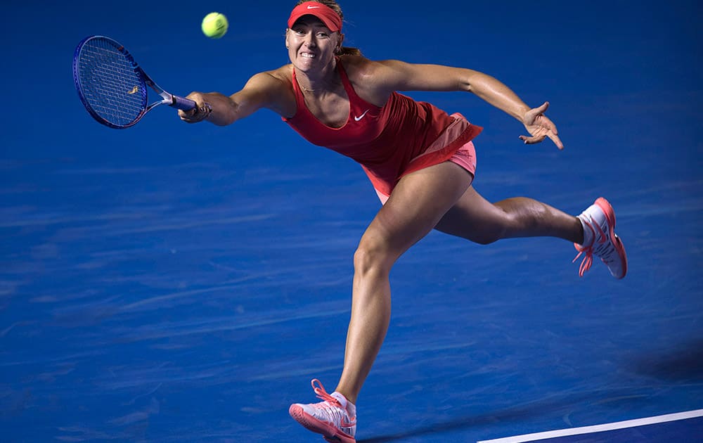 Maria Sharapova of Russia returns the ball to Magdalena Rybarikova of Slovakia during a Mexican Tennis Open quarterfinal match in Acapulco, Mexico.