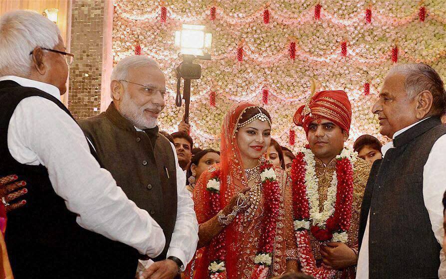 Prime Minister Narendra Modi at the wedding ceremony of Tej Pratap Singh Yadav, grand-nephew of SP chief Mulayam Singh Yadav (R) and Raj Laxmi, daughter of Lalu Prasad.