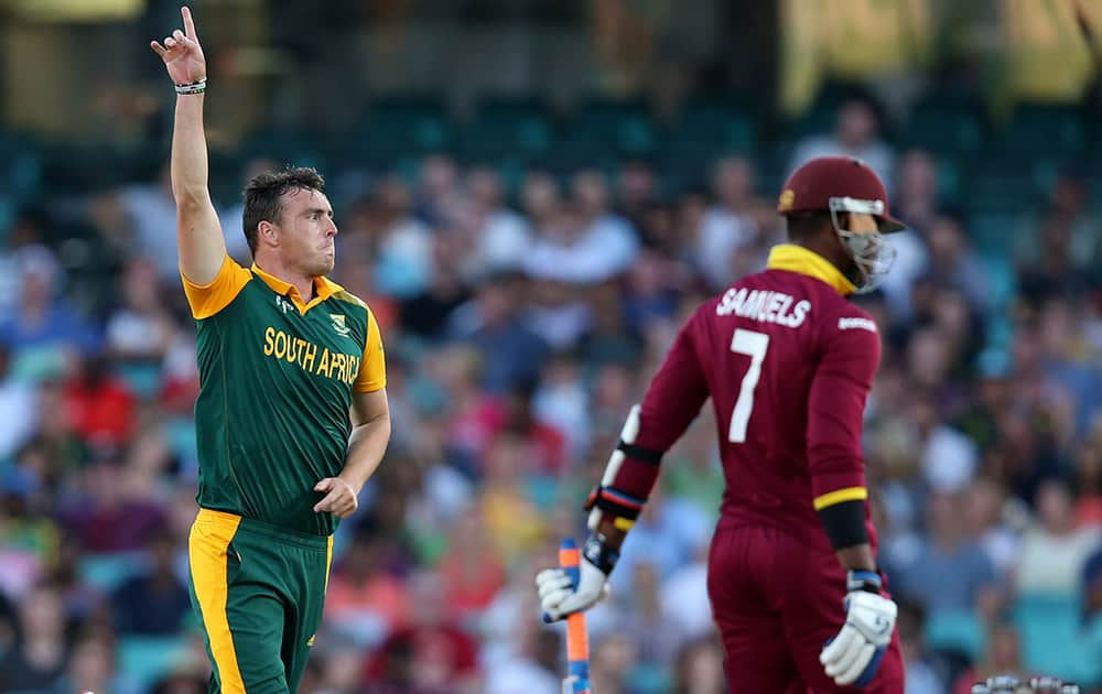 South Africa's Kyle Abbott celebrates after dismissing West Indies Marlon Samuels during their Cricket World Cup Pool B match in Sydney, Australia.