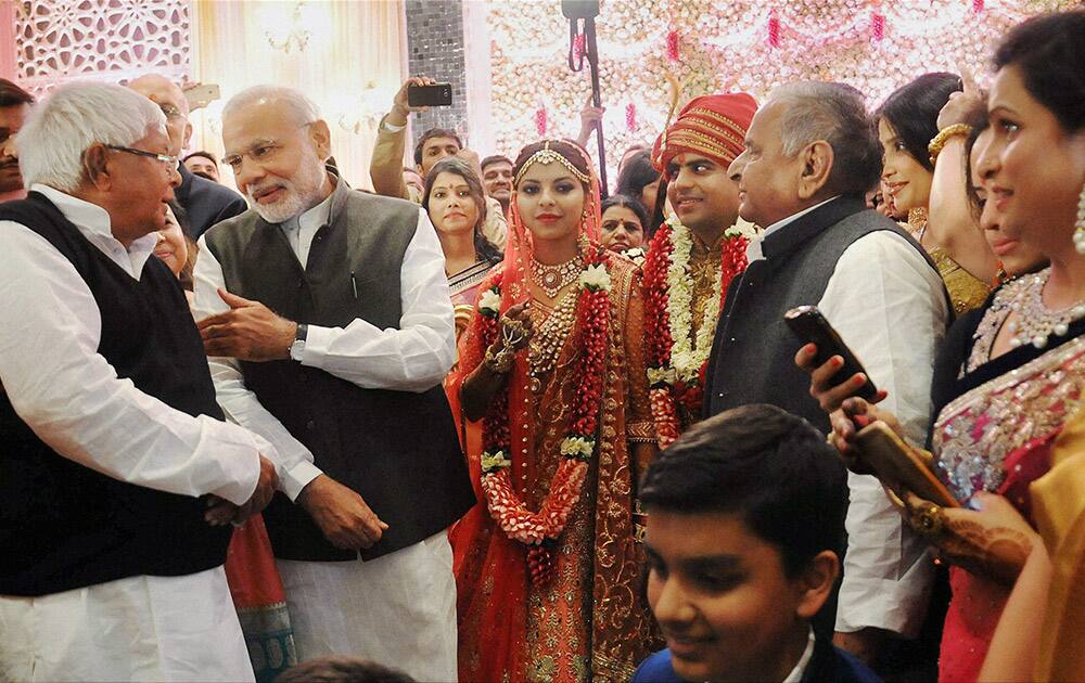 Prime Minister Narendra Modi at the wedding ceremony of Tej Pratap Singh Yadav, grand-nephew of SP chief Mulayam Singh Yadav and Raj Laxmi, daughter of Lalu Prasad, in New Delhi.