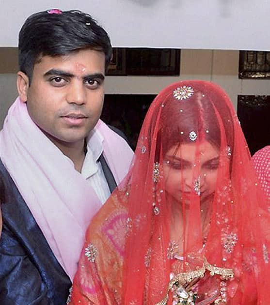 Newly married Tej Pratap Singh Yadav, grand-nephew of Mulayam Singh Yadav and Raj Laxmi, daughter of Lalu Prasad, on their arrival in Saifai.