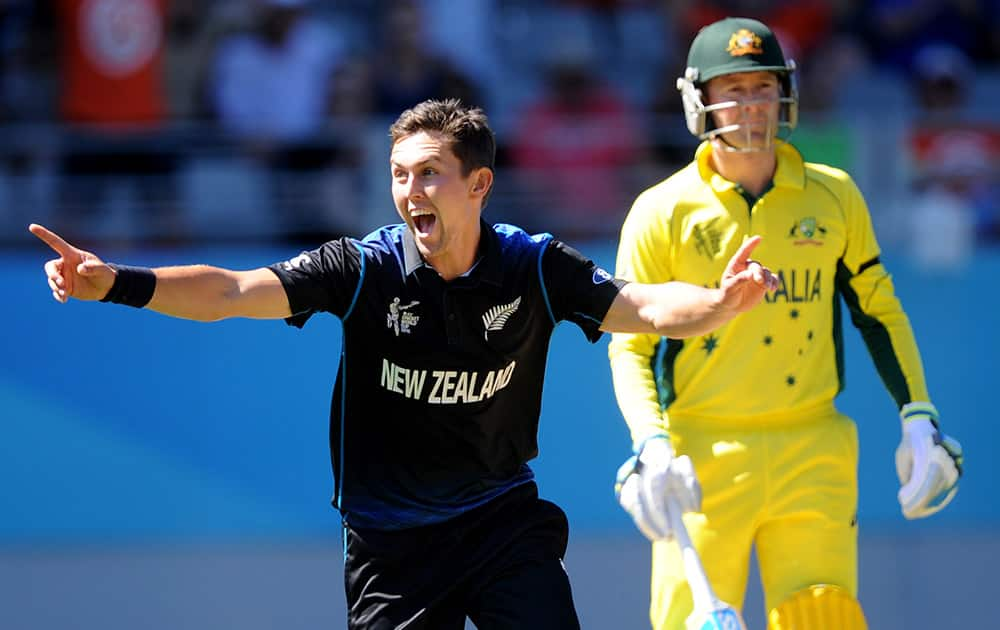 New Zealand's Trent Boult celebrates after taking the wicket of Australia's Australia's Mitchell Marsh during their Cricket World Cup match in Auckland, New Zealand