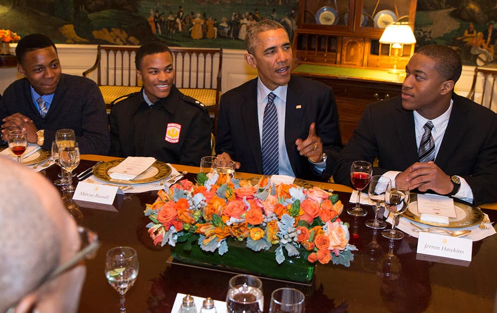 President Barack Obama hosts a lunch with 'My Brother's Keeper' mentees in the Map Room of the White House in Washington.