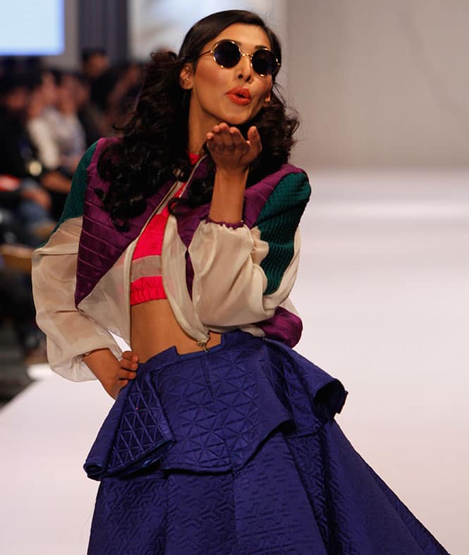 A model presents creations by Pakistan Institute of Fashion and Design at Expo Pakistan Fashion Show 2015.